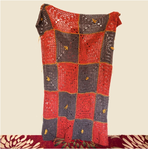 A wool granny square afghan by a Ghanaian designer in Queens